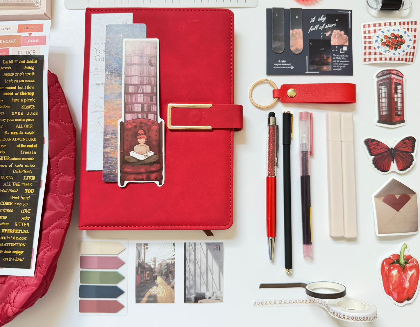 Red stationery gift box with notebook, pens and desk accessories