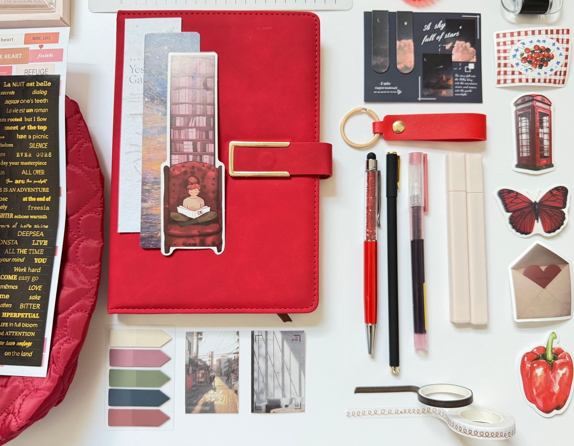 Red stationery gift box with notebook, pens and desk accessories