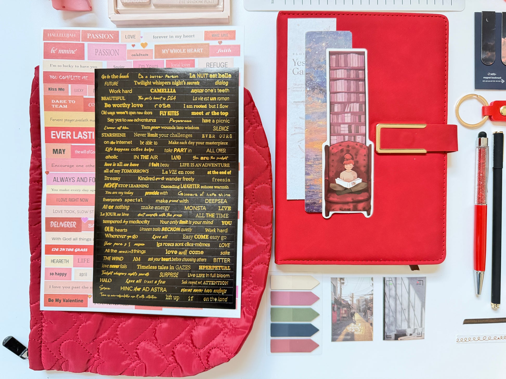 Red stationery gift box with notebook, pens and desk accessories